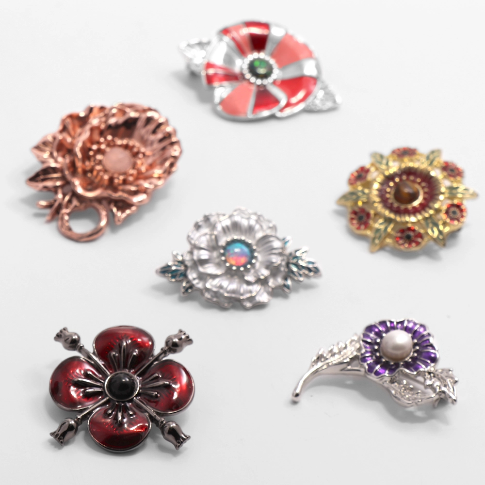 Precious Poppy Set of brooches on white background