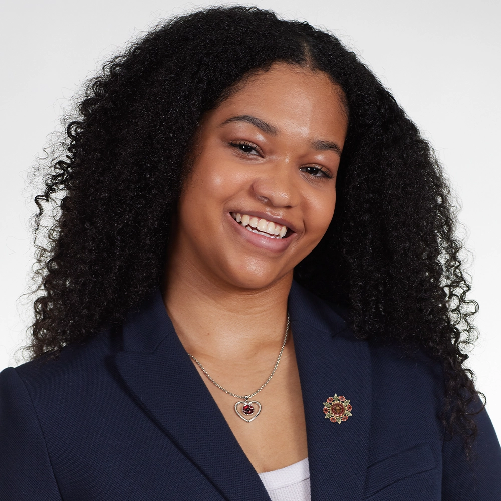 Model wearing Tiger's Eye Poppy Brooch